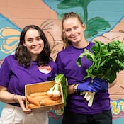 Grub Hub food pantry student volunteers pose with fresh produce