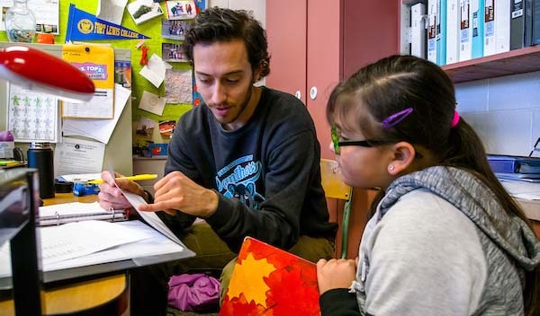 Fort Lewis student teacher works with elementary student