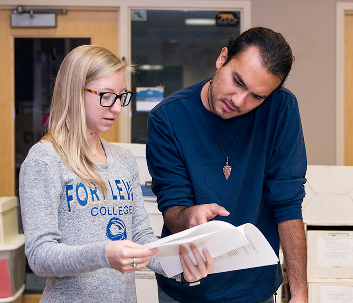 A FLC student archiving materials in the Center of Southwest Studies