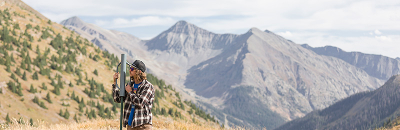 A student doing field work in the mountains